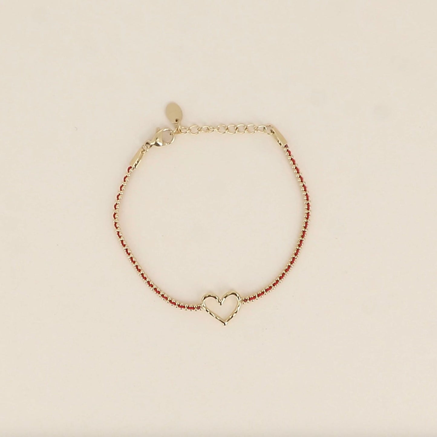Bracelet coeur ajouré chaine fil tressé