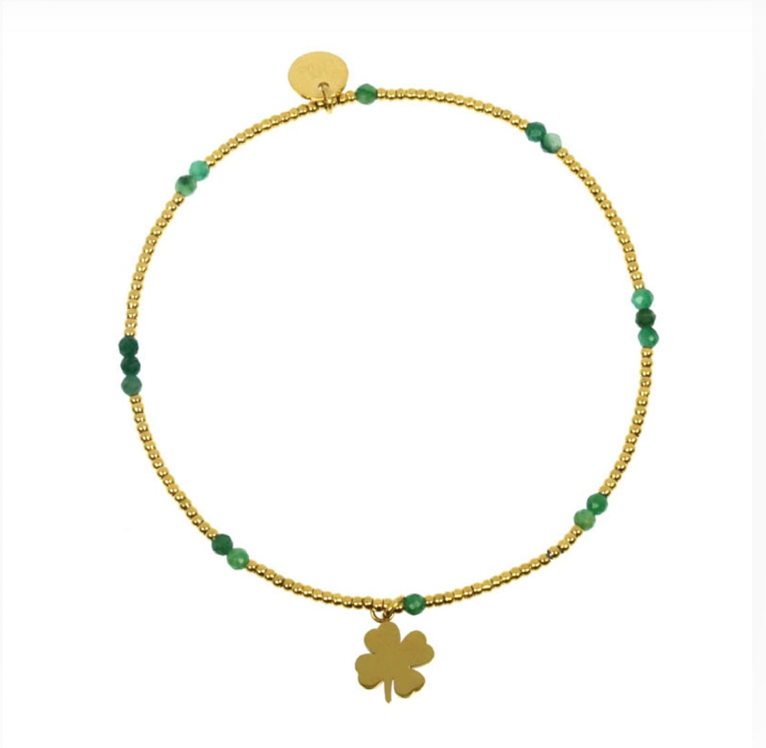 Bracelet trèfle lien élastique perles acier doré