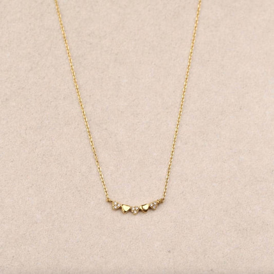 Collier doré motif cœurs et strass