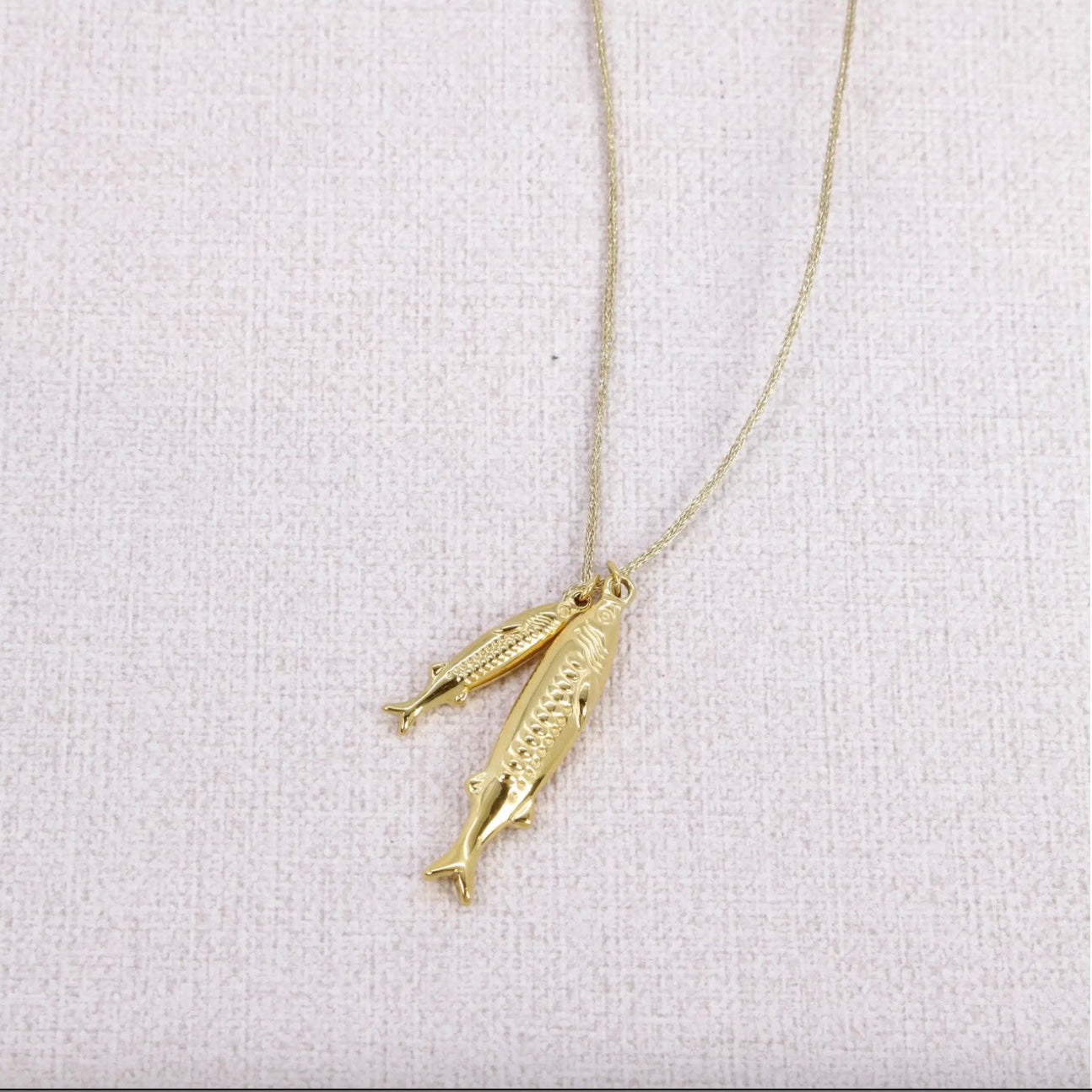 Collier lien doré 2 pendentifs poissons